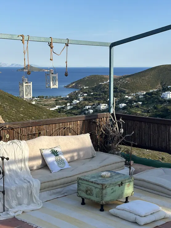 Outdoor wellness terrace with seating and a sea view at Eco House Patmos