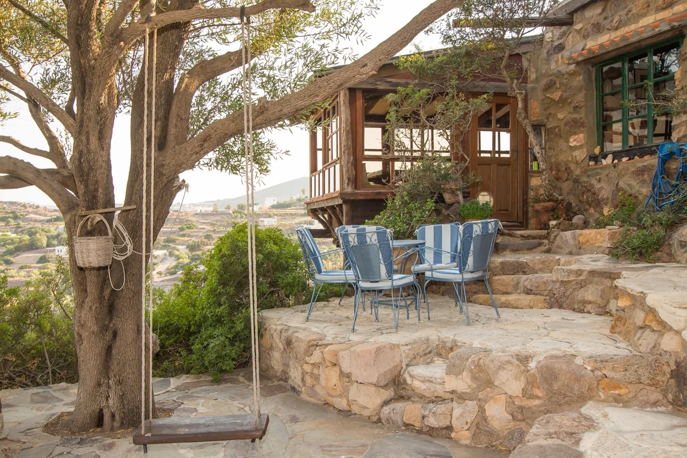 Stone terrace and outdoor table at Eco House Patmos