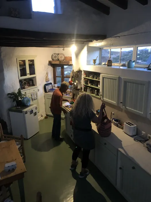 People preparing food together in the kitchen