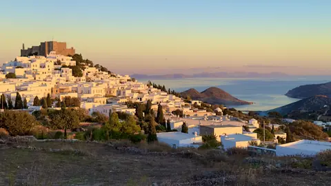 Chora and the monastery overlooking the Aegean at sunset