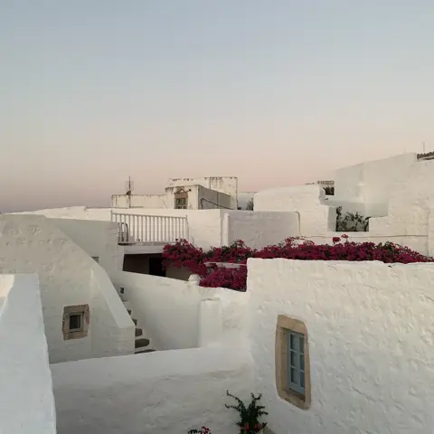 White rooftops and a shaded terrace in Chora on Patmos